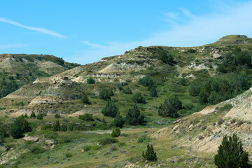 Fototapeta na wymiar Multi colored and layered rock hills at Theodore Roosevelt National Park