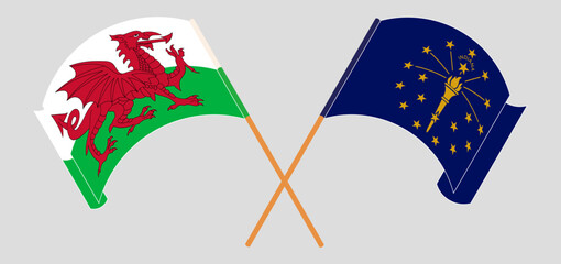 Crossed and waving flags of Wales and the State of Indiana