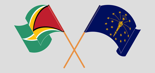 Crossed and waving flags of Guyana and the State of Indiana