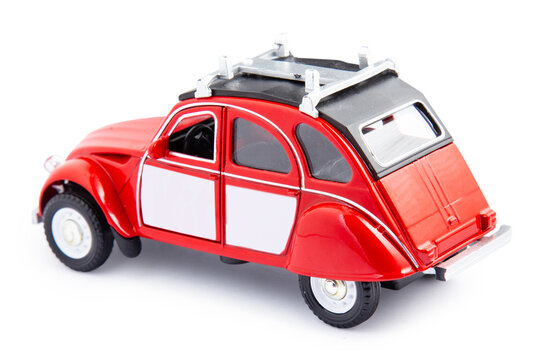 Miniature Toy Red Retro Car On White Background. Metal Model