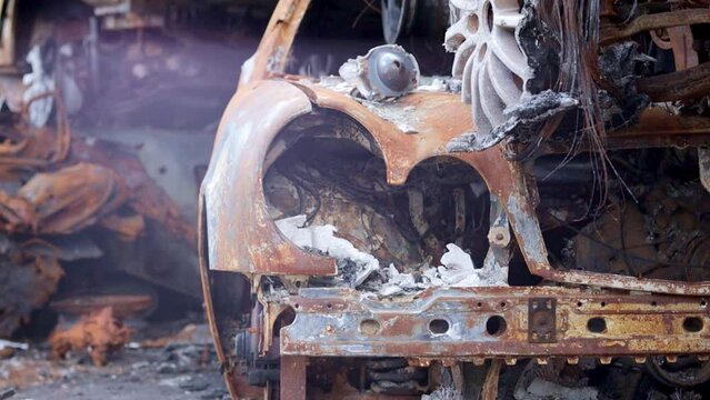 Russian invasion of Ukraine in 2022, destroyed and burned cars. The cars were beaten with shrapnel and burned. Irpinsky automobile cemetery. Consequences of the war in a peaceful city near Kyiv.
