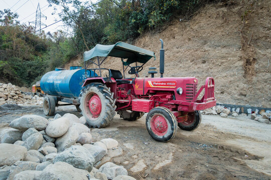 April 2nd 2022. Dehradun uttarakhand India. A water tank carrying tractor trolley ( goods carrying vehicle ) at a construction site in rural India. Road construction.