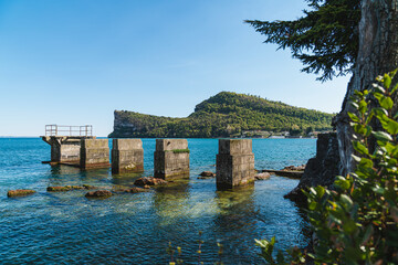 Landscape of an Old Bridge interrupted and Rocca di Manerba del Garda in the background.