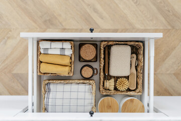 Eco-friendly products and towels in drawer organizer - obrazy, fototapety, plakaty