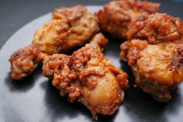  fried chicken fillets on plate on blue background 