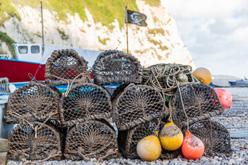 A stack of lobster or crab or prawn pots waiting on the beach for the next fishing voyage