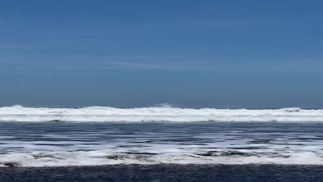 Las Lisas, Guatemala. Waves crashing on the sea and coming directly towards the viewer. Ideal for Social Media travel or vacation campaign. Vertical Video.