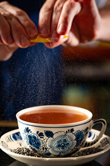 Expressing Lemon Zest into a 'Tea' Cocktail.