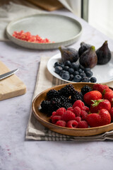 preparing a breakfast with red fruits