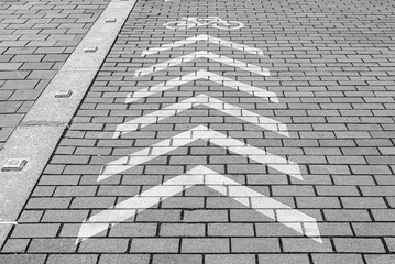 Bicycle path on a stone pavement with paving stones.