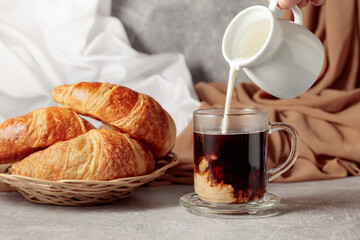 Croissants and coffee with cream.