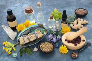 Cleansing ritual ingredients with sage smudge stick, crystals, essential oils, herbs and flowers....