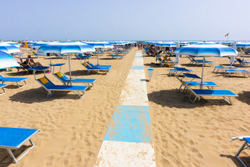Traditional beach chair and umbrella. Rimini, Italy, 
