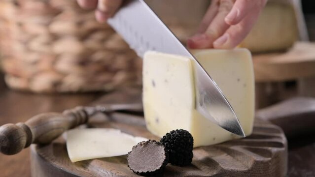 Pecorino cheese with truffle, traditional Italian sheep's milk cheese with truffle. A typical product of the dairy regions of Tuscany and Sardinia. High quality 4k footage