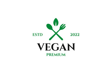 Flat logo for vegan with spoon and leaf design illustration idea