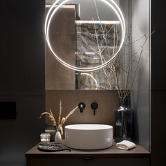 Elegant, round led lamp in modern bathroom, close-up