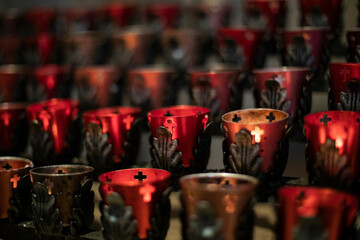 Close up of votive candle rack in a catholic cathedral in New Mexico