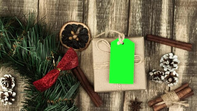 Box with twine and tag, background with copy space. Chroma key. Christmas card. View from above. Copy space - image. Camera zoom