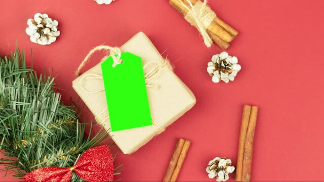 Box with twine and tag, background with copy space. Chroma key. Christmas card. View from above. Copy space - image. Camera zoom