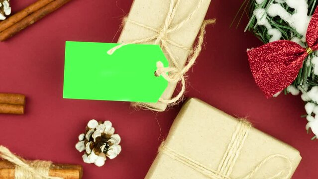 Box with twine and tag, background with copy space. Chroma key. Christmas card. View from above. Copy space - image. Camera zoom
