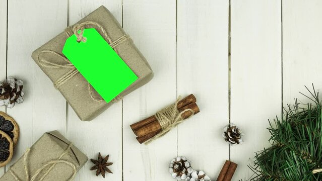 Box with twine and tag, background with copy space. Chroma key. Christmas card. View from above. Copy space - image. Camera zoom