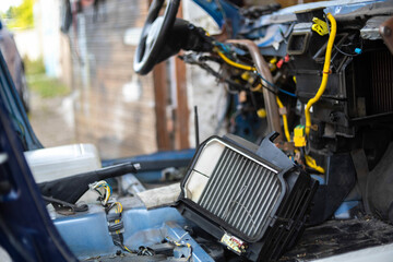 repair and installation of a new car interior heater radiator. Disassembled panel.