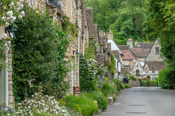 honey coloured Cotswold stone houses in Castle
Combe Wiltshire England often named as the 
prettiest village in England