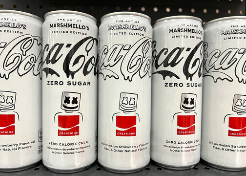 Alameda, CA - August 01, 2022: Grocery store shelf with cans of Coca-Cola brand soda, limited edition The Artist Marshmello's watermelon strawberry flavored beverage. Sugar and No Sugar Versions.