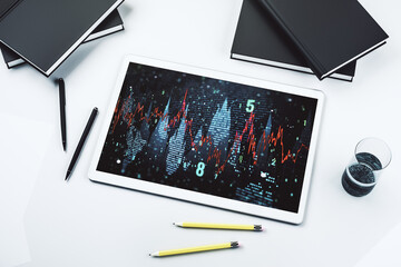 Modern digital tablet display with abstract financial graph, financial and trading concept. Top view. 3D Rendering