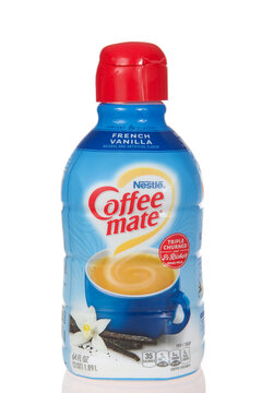 Alameda, CA - August 8, 2022: Bottle of Nestle brand Coffee mate creamer, triple churned and 2x Richer than milk. French Vanilla. Isolated on white with reflective table.