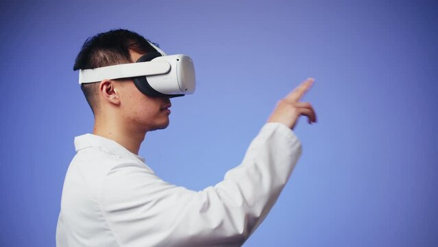 Korean man doctor using virtual reality glasses, playing video games, Asian guy nurse wearing new generation gaming headset for education, future technology concept.