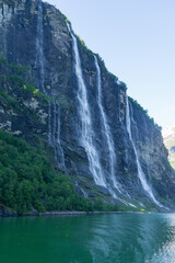 Naklejka na ściany i meble Impressive waterfall of the seven sisters in the Geiranger fjord in Norway.