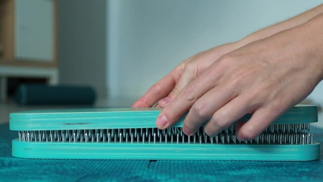 Close, fold the sadhu board. Board with needles side view. The concept of healthy practice sadhu-yoga.