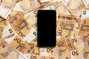 Fototapeta na wymiar smartphone with blank display mockup screen on 50 euro banknotes. Modern technology, communication and online trade using gadget concept. Money paper. Concept of business, investment and income growth