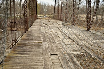 Wooden boards of a closed down bridge near Owosso, Michigan that used to be used for the New Haven Coalmine. - obrazy, fototapety, plakaty