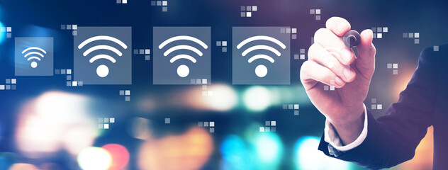 Wifi concept with businessman on night city background