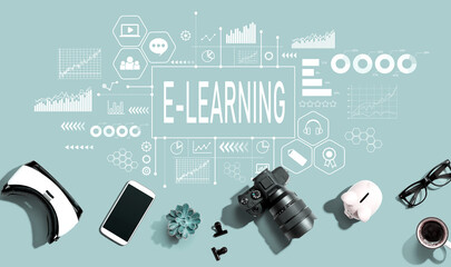 E-Learning theme with electronic gadgets and office supplies - flat lay