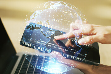 Multi exposure of abstract graphic coding sketch with world map and hand working with a digital tablet on background, big data and networking concept