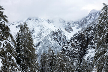 Fototapeta na wymiar Winter Mountain landscape in Julian Alps Slovenia on Mountain Pass Road of Vrsic Slovenia