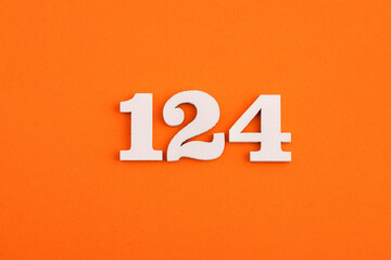 Number 124 - On orange foam rubber background