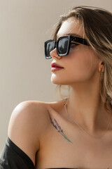 Women's sensual portrait of a beautiful urban fashionable model girl with clean skin with cool...
