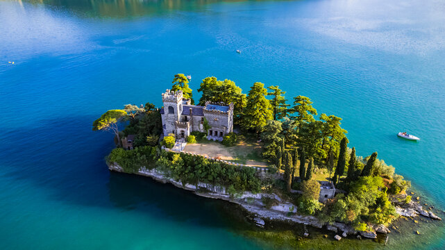 Lake Iseo Italy with Loreto Island and Medieval Style Castle. Aerial Drone Panorama of Lombardy Alps Scenery. Famous Landmark in Brescia Province