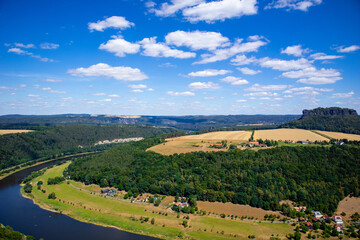 Naklejka premium River valley with houses, meadows and trees