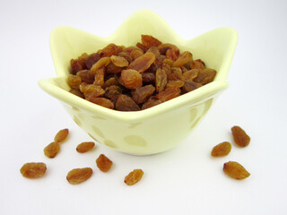     a bowl of yellow golden raisins             