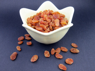          a bowl of yellow golden raisins     