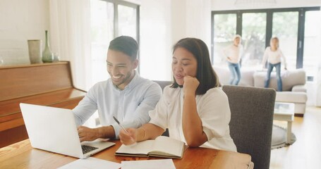 Home budget, finance planning and money management with a happy couple in the dining room and kids in the background. Family investment and savings for the future and their carefree children