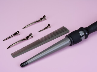 Professional set of hairdresser for hair styling, curling. Curling iron in the form of a cone...