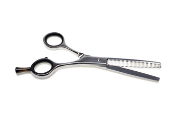 Professional Barbers thinning scissors, isolated on white background. Closeup. Hairdresser service, salon concept. Haircut accessories