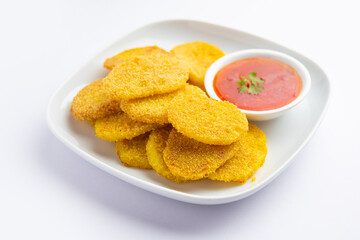 crispy potato rava fried slices or batatyache kaap or batata semolina fry snacks from India