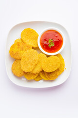 crispy potato rava fried slices or batatyache kaap or batata semolina fry snacks from India